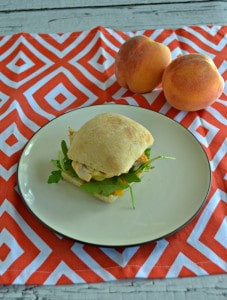 Take a bite out of this delicious Chicken, Peach, and Arugula Sandwich on a Foccacia Roll