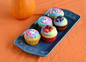 Fun Vanilla Flavored Cupcakes with multi-colored frosting makes the perfect Sugar Skull Cupcakes for the Day of the Dead