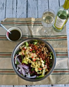 Harvest Salad is a tasty combination of lettuce topped with red onions, cheese, walnuts, and cranberries with a homemade vinaigrette then paired with Gallo Family Vineyards Pinot Grigio