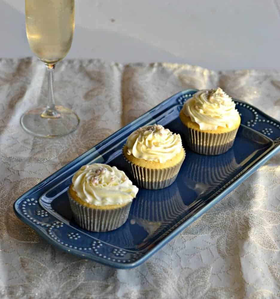 Vanilla Cupcakes Topped with Champagne Frosting and edible pearls are great for parties, weddings, and celebrations