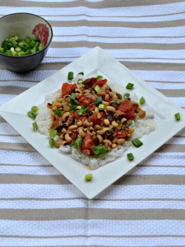 Hoppin John is a traditional southern dish made with black eyed peas, vegetables, Cajun seasoning, and rice