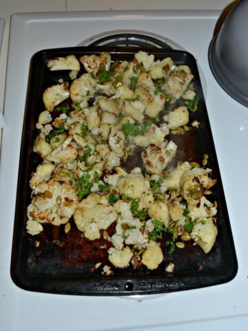 Roasted Cauliflower topped with Brown Butter, Pumpkin Seeds and Lime juice makes a flavorful side dish