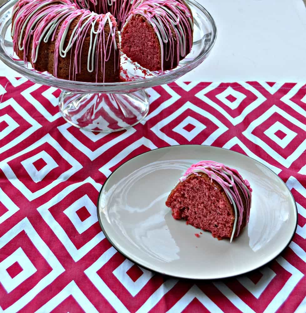 A delicious Cherry Vanilla Bundt Cake with a pink and white drizzle is perfect for Valentine's Day