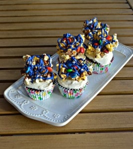Movie Theater Cupcakes combine chocolate cupcakes with Coca-Cola frosting and Popcorn Balls with M&M'S on top!
