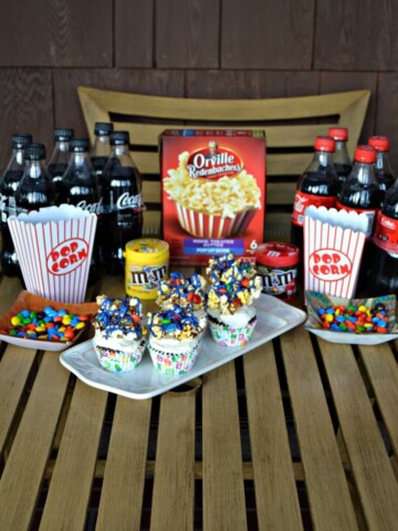 Have a movie night at home with soda, popcorn, candy, and my delicious Movie Theater Chocolate Cupcakes!