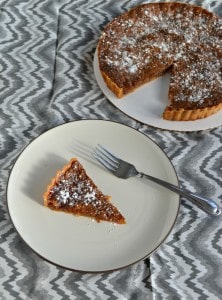 Check out this delicious and simple recipe for Brown Sugar Pie with powdered sugar on top!