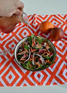 Make yourself a hearty Winter Salad with onions, nuts, blood oranges, and cheese along with a homemade Blood Orange Vinaigrette