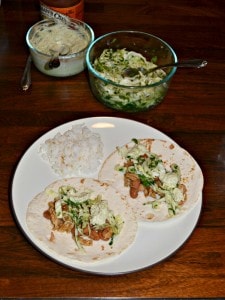 Take a bit of these incredible Pork and Pinto Bean Tacos with jalapeno Slaw on top!