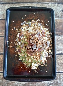 Pile bacon, sunflower seeds, oats, pepitas, and dates high in a pan and mix with honey and cinnamon for a delicious Bacon Granola.