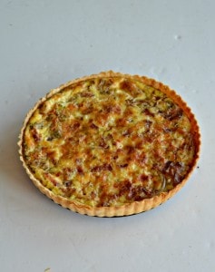 Love this pretty and tasty Caramelized Onion, Bacon, and Cheddar Egg Tart