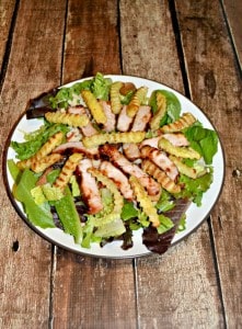 Get the grill going for this BBQ Pork Salad topped with grilled fries
