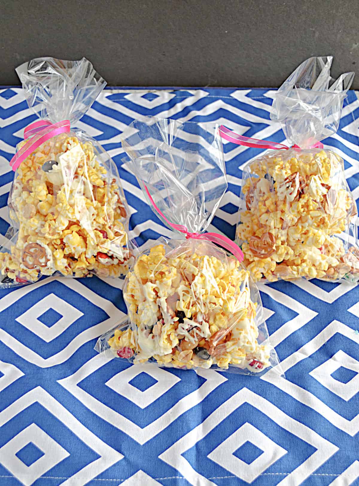 Three bags of popcorn.