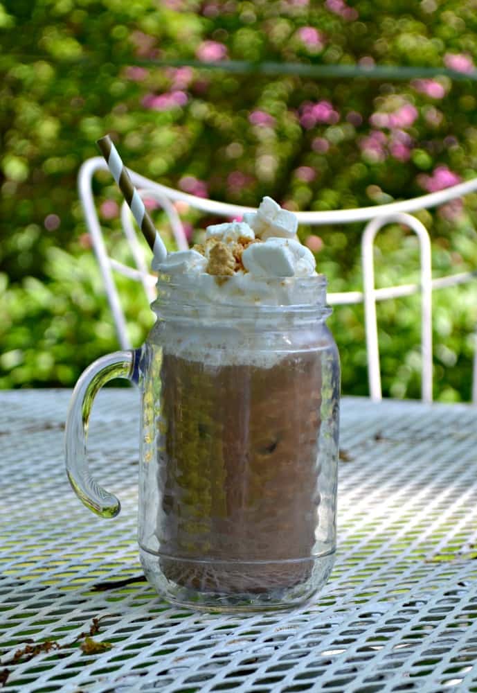 S'mores Iced Coffee starts with Mocha Coffee and finishes off with whipped cream, marshmallows, and graham crackers!