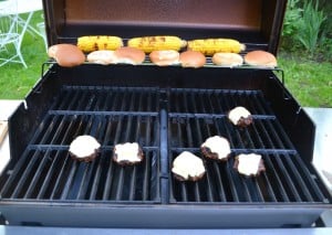 Grill juicy burgers, top them with cheese, then brush them with a homemade BBQ sauce.