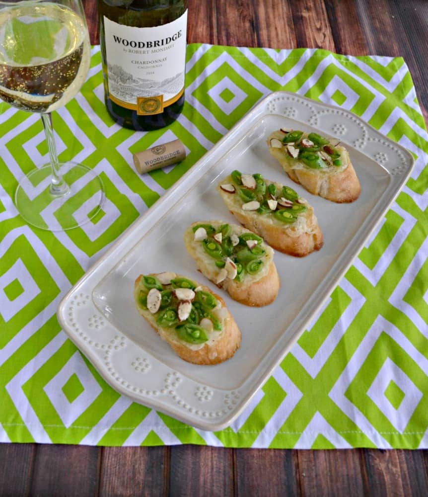 Every party needs a great appetizer and wine so make this Crostini with Brie, Fresh Peas, and Honey + a fun Wine Pairing