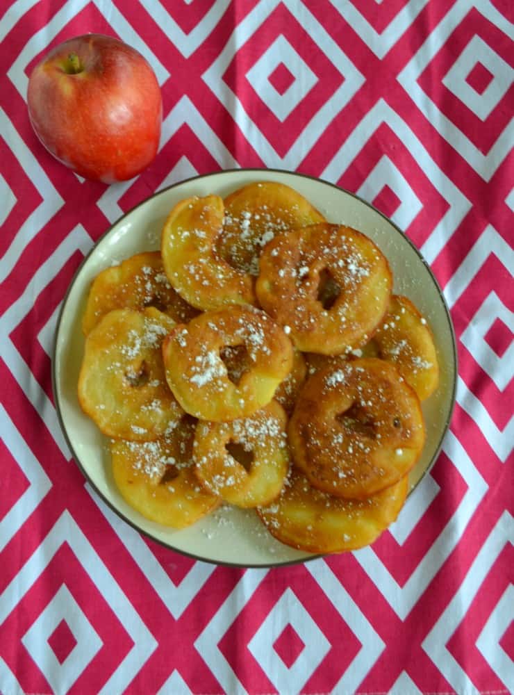 Try these easy to make Fried Apple Fritters topped with powdered sugar!