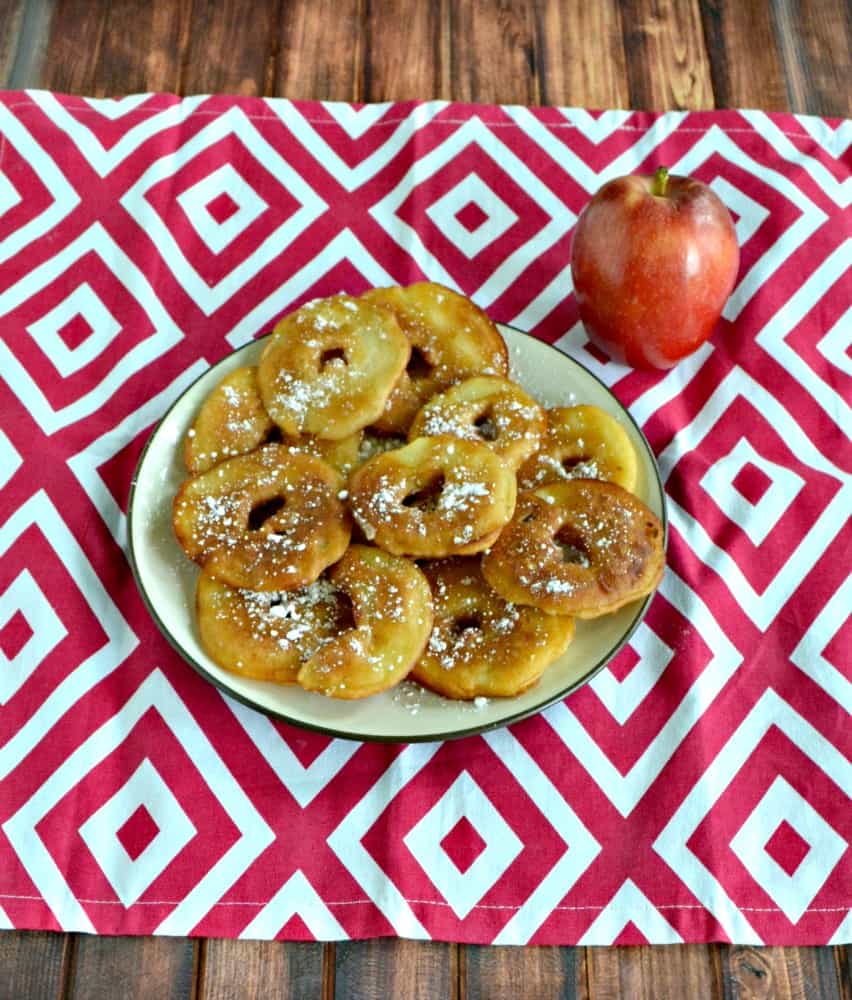 Fry up these crispy Apple Fritters sprinkled with powdered sugar