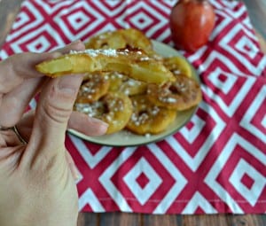 Bite into a crisp Apple Fritter sprinkled with powdered sugar