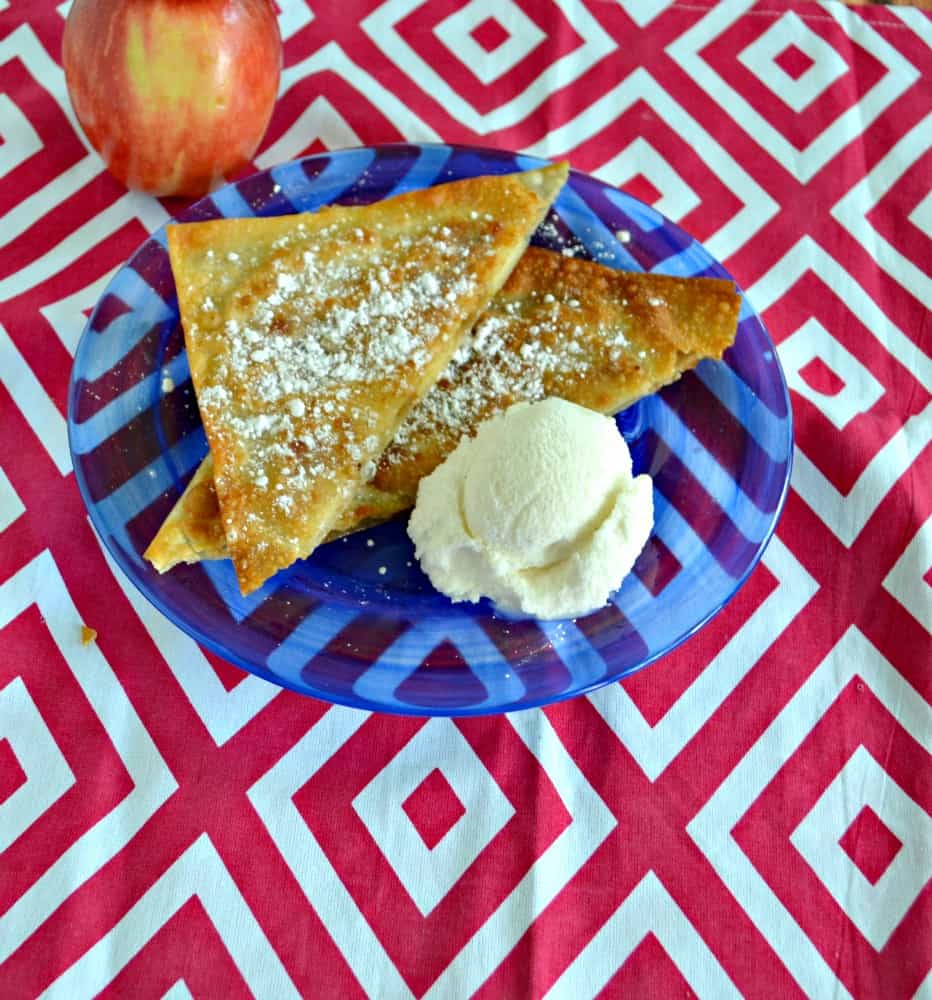 Delicious WOnton Apple Pockets take apples wrapped in wonton and fry them to a golden brown then sprinkle them with powdered sugar for the ultimate dessert!