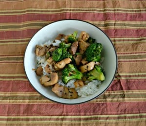 This delicious weeknight meal is Chicken Thighs with Broccoli with a Ginger Sesame Glaze in a rice bowl
