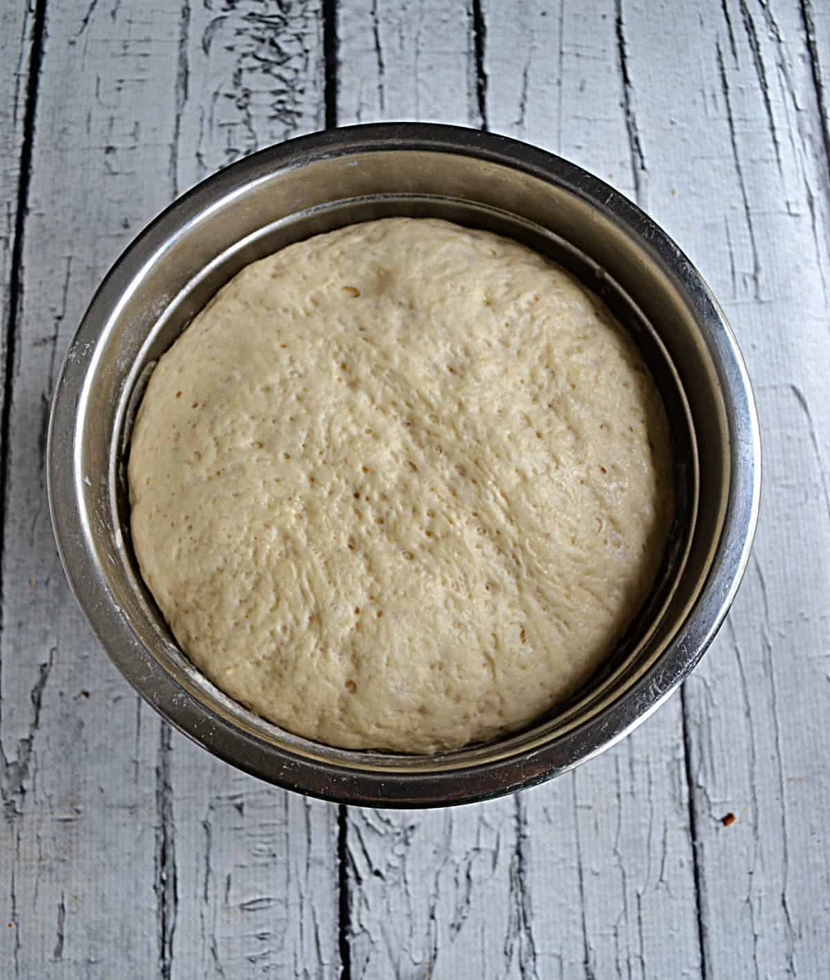 A bowl of rising bread dough.