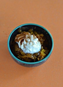 Love this warm and gooey Pumpkin Pecan Cobbler that makes it's own sauce as it bakes and is topped off with whipped cream!