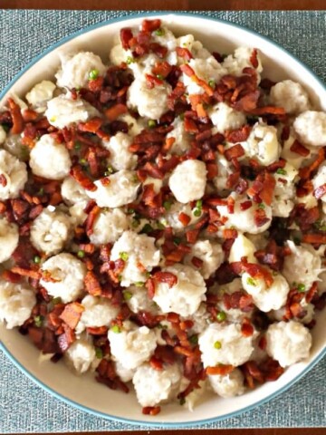 Dig into this traditional Halusky: Potato Dumplings with Sheep cheese, bacon, and chives!