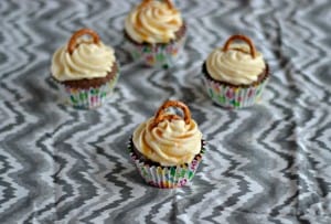 Ready for a fun holiday dessert? These Salted Caramel Chocolate Cupcakes topped off with a pretzel are a fun holiday treat!