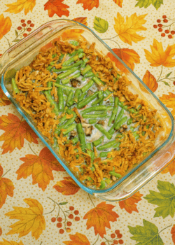 A baking dish with green beans, cream sauce, and fried onions.