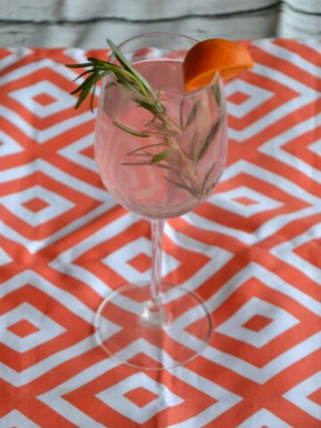 Love the pretty pink color of this Blood Orange and Rosemary Sangria