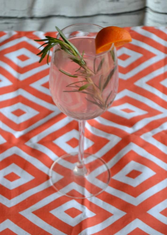 Love the pretty pink color of this Blood Orange and Rosemary Sangria