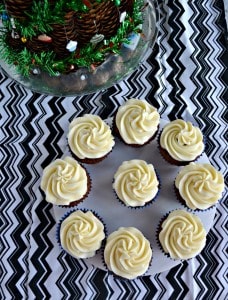 Take a bite out of these spiced Gingerbread Cupcakes topped with Eggnog Frosting.