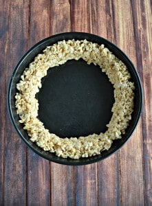 Making the "crust" of this fun Pumpkin Pie Rice Krispies Treat!