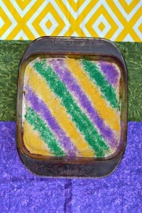 A layer of sugar cookie, and layer on cheesecake and a layer of sprinkles made these King Cake Cookie Bars sparkle!