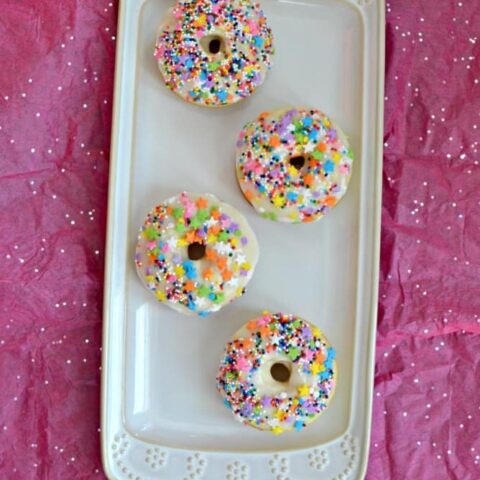 Love donuts but hate the calories? Try these Baked Vanilla Donuts with a Vanilla Glaze and Sprinkles for a healthier donut!