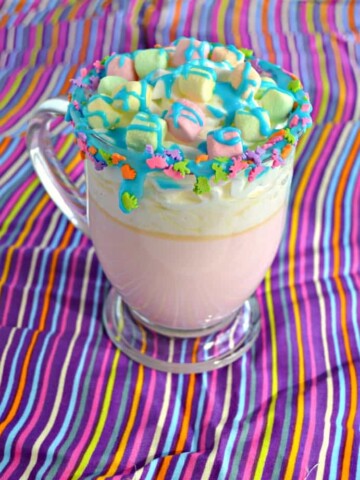 Kids will adore this colorful Unicorn Hot Chocolate made with white hot chocolate and colorful toppings!