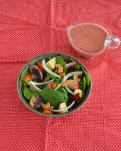 Looking to eat clean? Try this colorful and delicious Fruit and Nut Salad with Berry Vinaigrette!