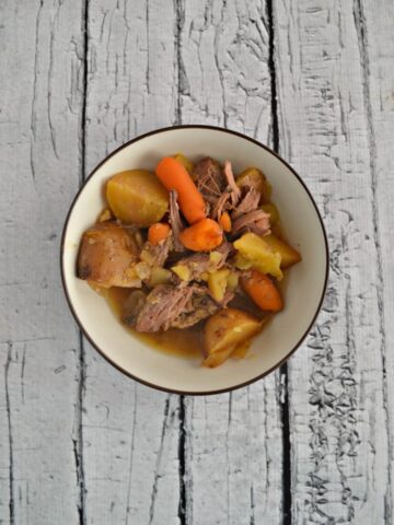 The whole family will enjoy this tasty Slow Cooker Pot Roast with Carrots and Potatoes.