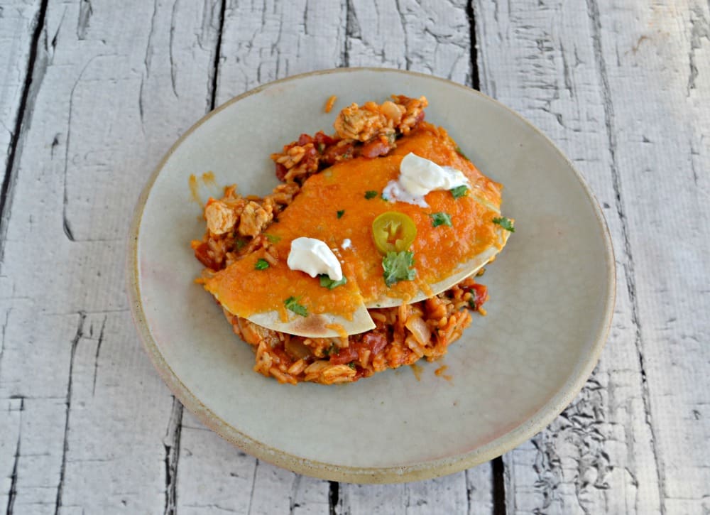 Looking for an easy weeknight meal? Try this One Pan Chicken Enchilada Rice Bake!