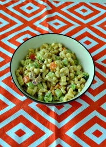 Looking for a great summer salad? Try this awesome Loaded Macaroni Salad with vegetables, cheese, bacon, and more!
