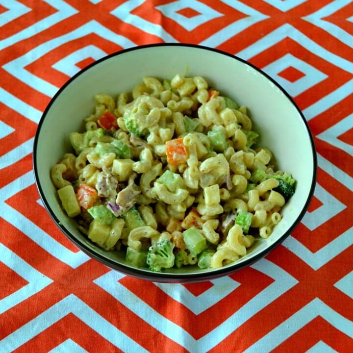 Looking for a great summer salad? Try this awesome Loaded Macaroni Salad with vegetables, cheese, bacon, and more!