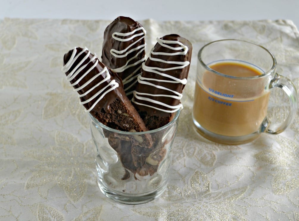 We love this tasty Brownie Mix Biscotti dipped in chocolate and served with a cup of coffee.