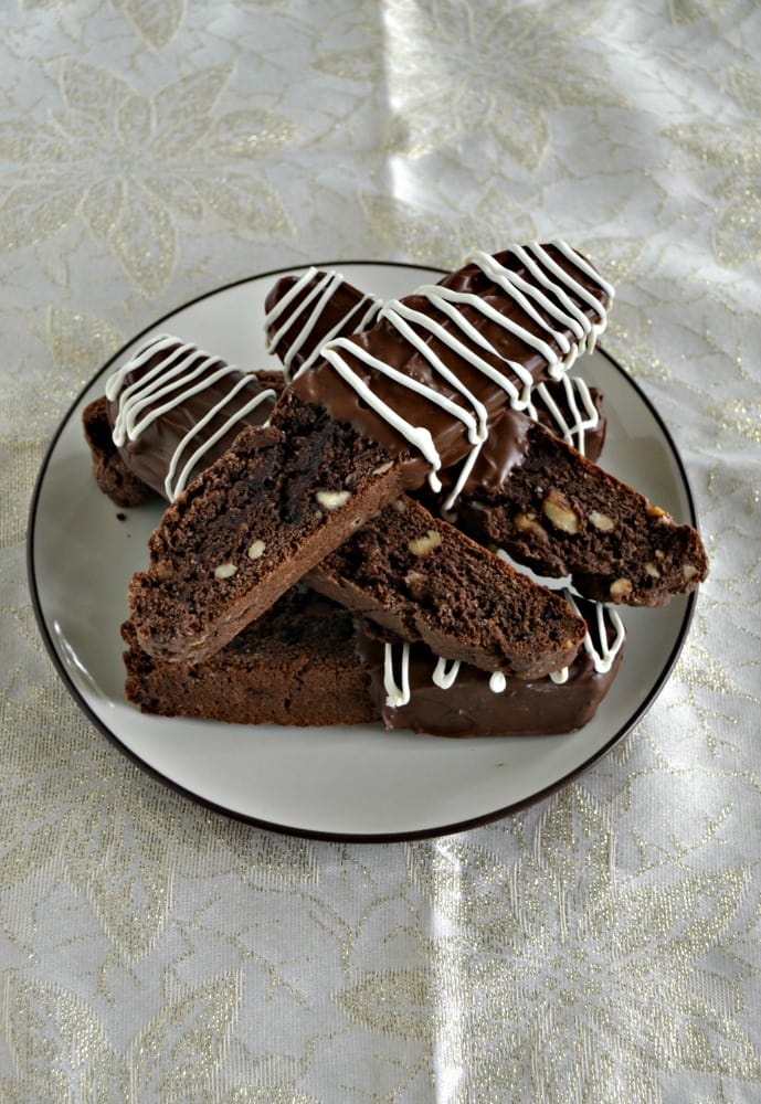 A plate with chocolate biscotti piled on it.
