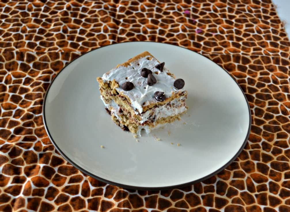 Don't turn on the oven! Make this awesome No Bake S'mores Cake with chocolate ganache, marshmallow whipped cream, and a graham cracker crust!