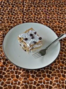 Don't turn on the oven! Make this awesome No Bake S'mores Cake with chocolate ganache, marshmallow whipped cream, and a graham cracker crust!