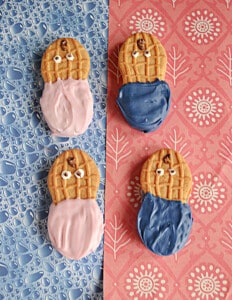 Four cookies decorated to look like babies.