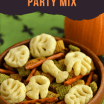 Pin Image: Title, a wooden bowl of snack mix with a pumpkin behind the bowl.