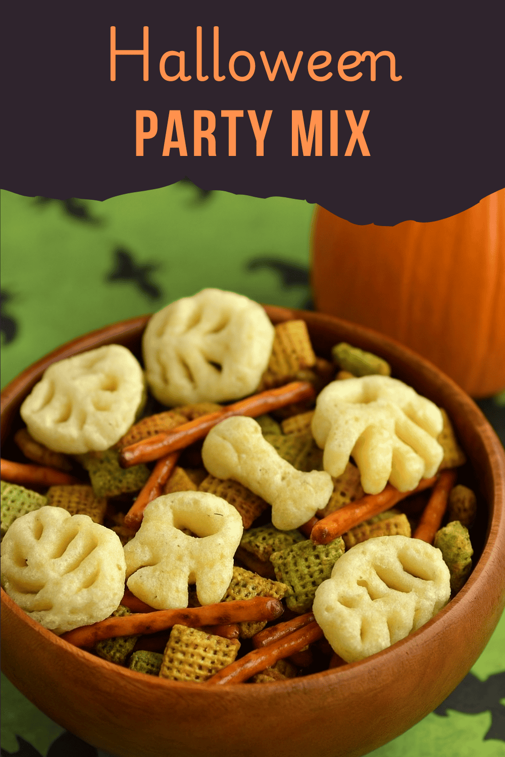 Pin Image: Title, a wooden bowl of snack mix with a pumpkin behind the bowl.