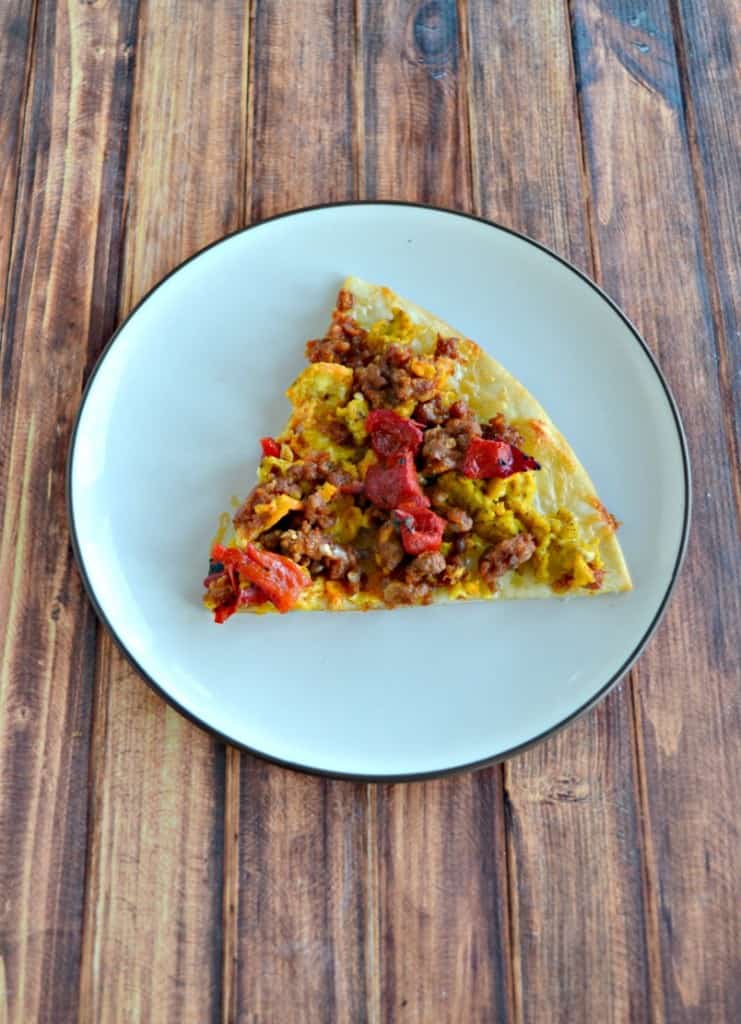 Pizza for breakfast? When it's topped with eggs, roasted red peppers, sausage, and onions you can have pizza for breakfast any day!