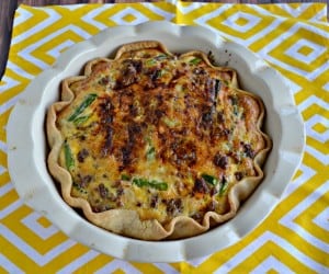Hosting a brunch? Don't forget the tasty Sausage, Onion, and Asparagus Quiche!